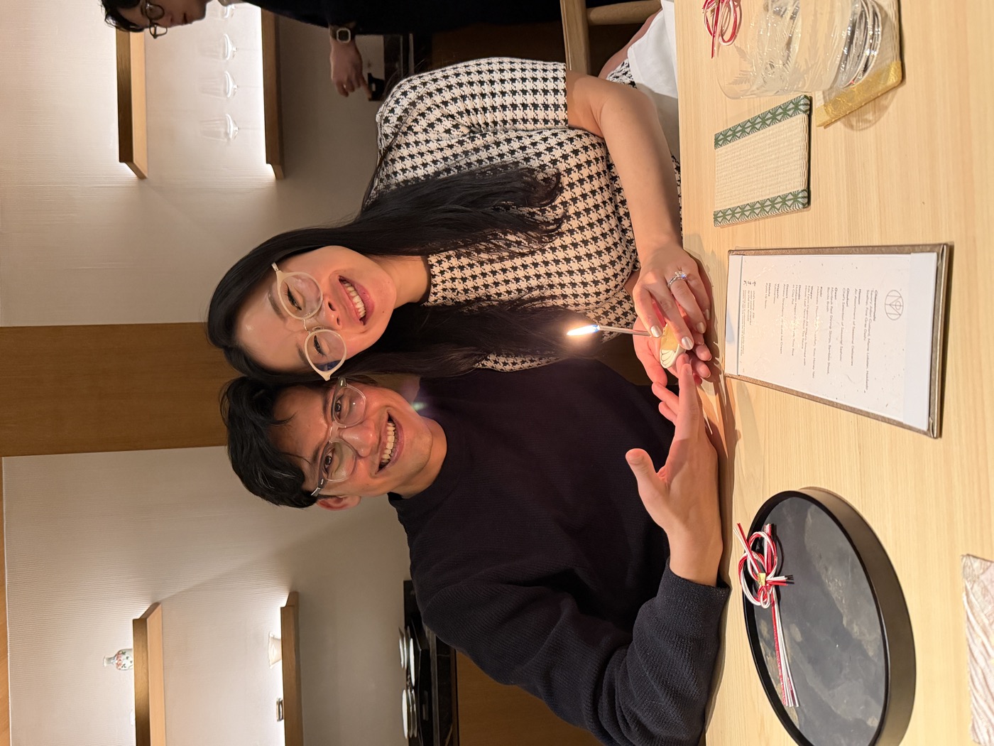 The two of us with a small candle lit on the counter to celebrate