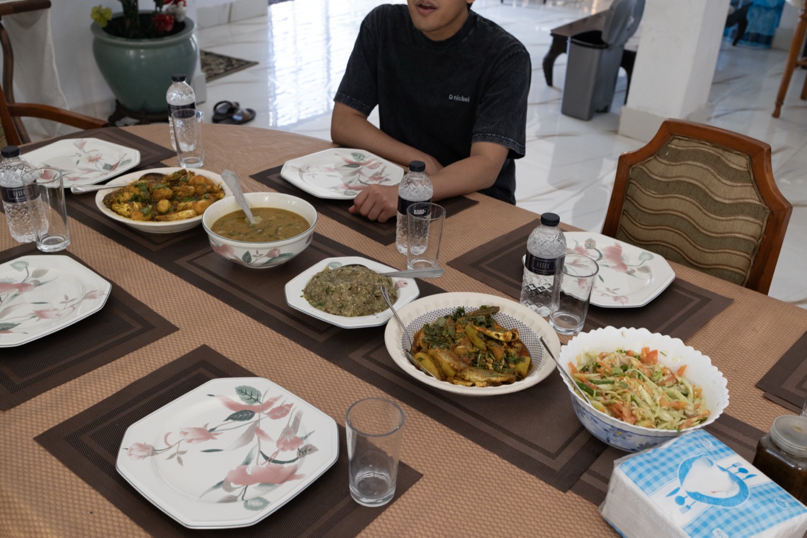 A home-cooked meal spread on the table in Chittagong