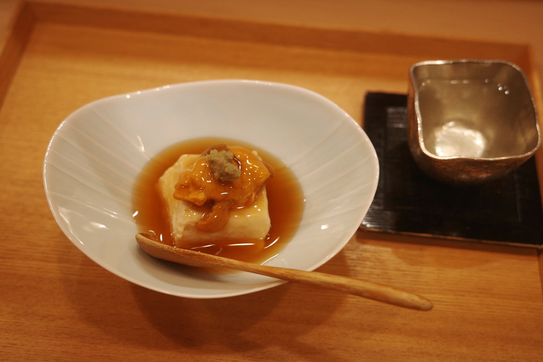 Silken tofu topped with sea urchin in a gingered dashi sauce
