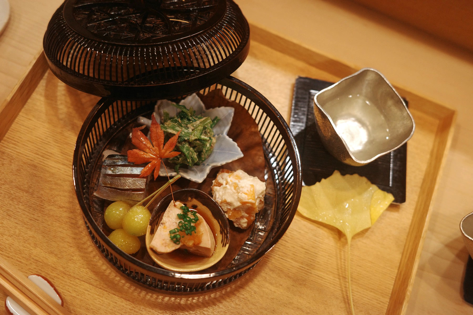 A seasonal basket of small bites at Satoki in Ginza