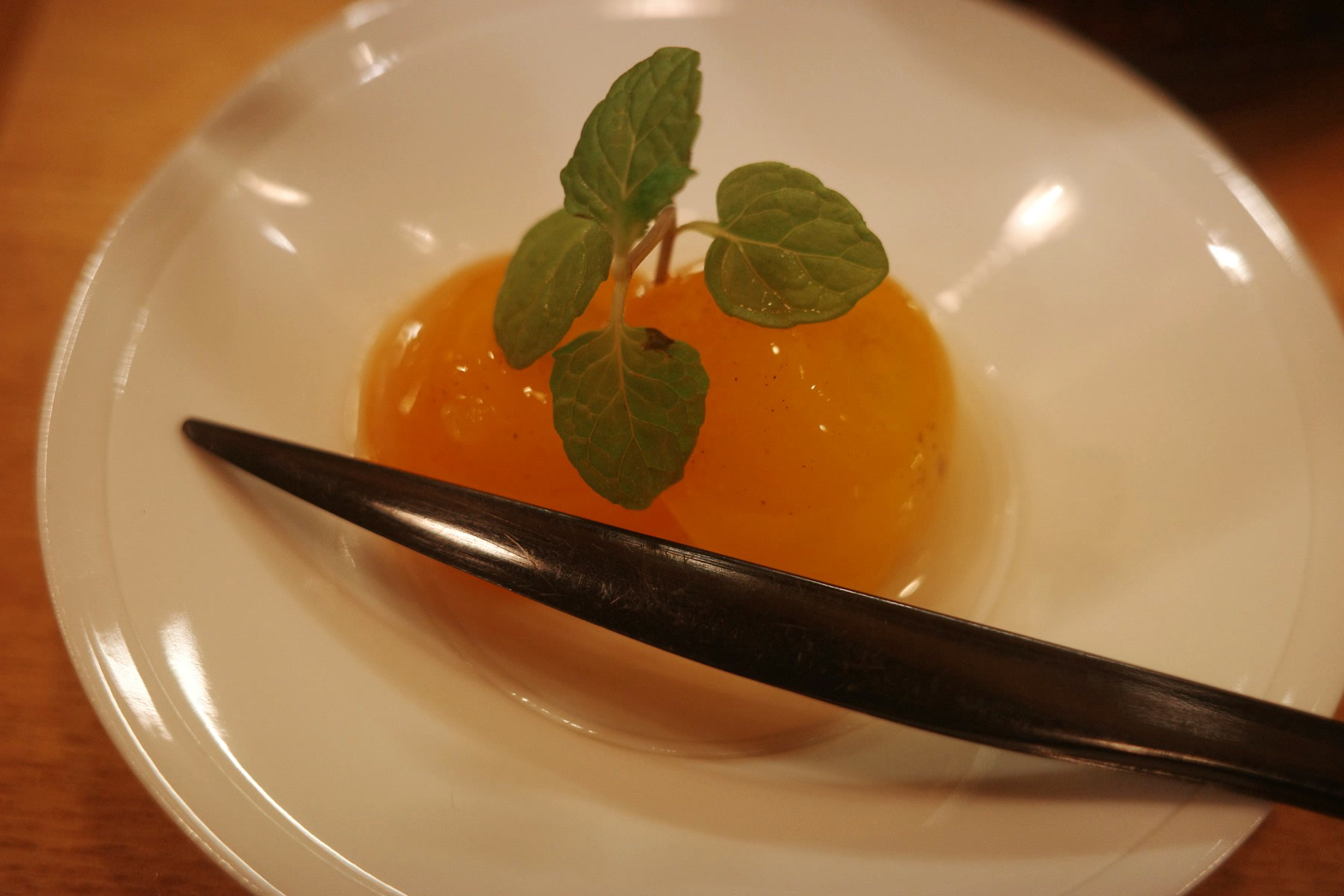Close-up of the mandarin jelly with a sprig of mint